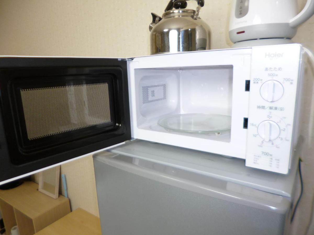 Appartamento ザミッキーカールトン井尻102 Shiobaru Esterno foto