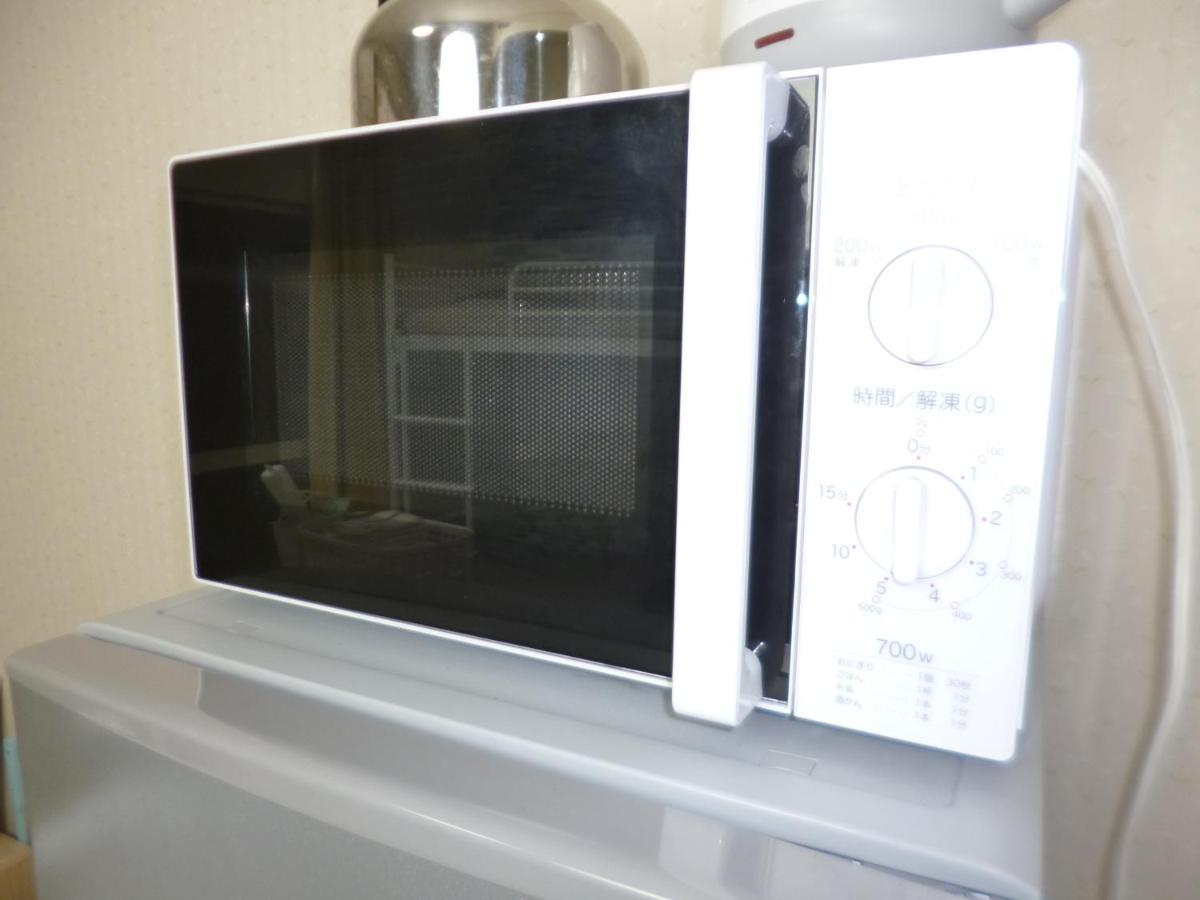 Appartamento ザミッキーカールトン井尻102 Shiobaru Esterno foto